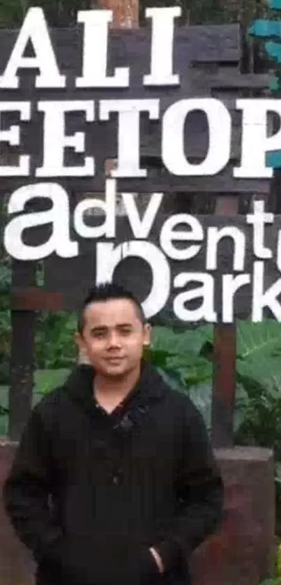 Person standing at Bali Treetop Adventure Park, lush surroundings.