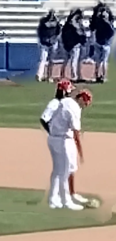 Baseball players on field at sports venue with green grass.