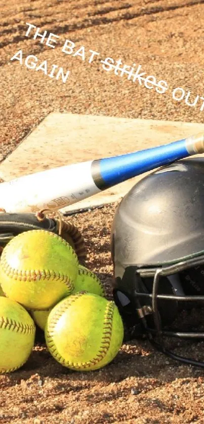 Baseball gear on a sunny field, featuring a bat, helmet, and softballs.