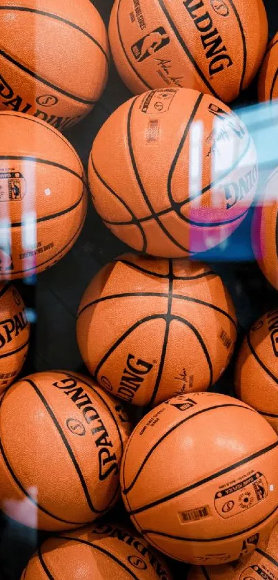 Vibrant Spalding basketballs wallpaper in orange hues for mobile devices.