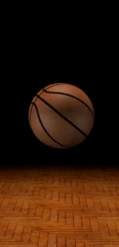 Basketball on a wooden court with a dark background.