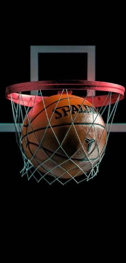 Basketball passing through a hoop on a dark background.