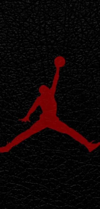 Silhouette of basketball player dunking on textured black background.