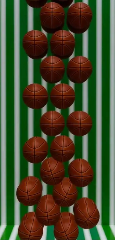 Basketballs rolling down a green striped surface.