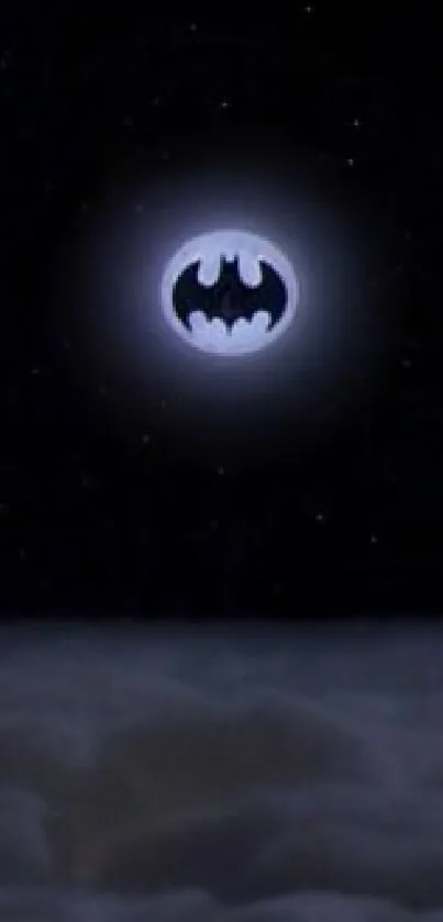 Batman signal shines in the night sky over clouds.