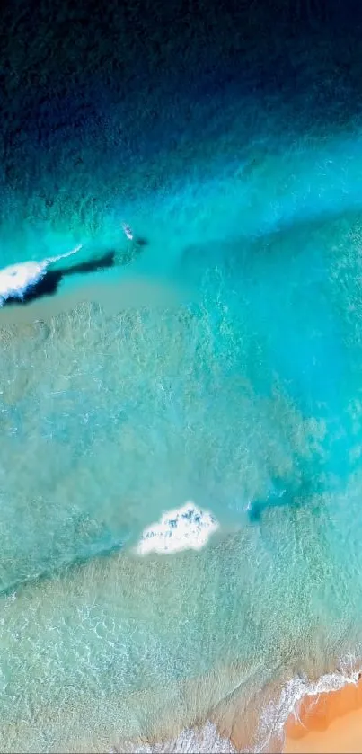Aerial view of a beach with waves and sandy shore, perfect mobile wallpaper.