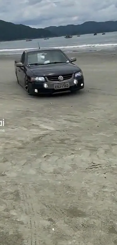 Car driving on a sandy beach with ocean view.