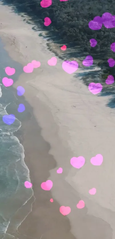 Aerial view of beach with pink and purple hearts, perfect for romantic wallpaper.