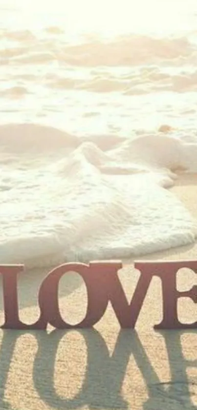 Serene beach with love letters and ocean waves in sunlight.