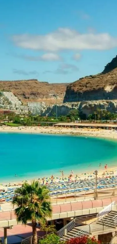 Serene beach view with turquoise water and cliffs under a blue sky.