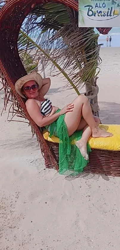 Woman relaxing on a beach chair in Brazil with ocean in background.