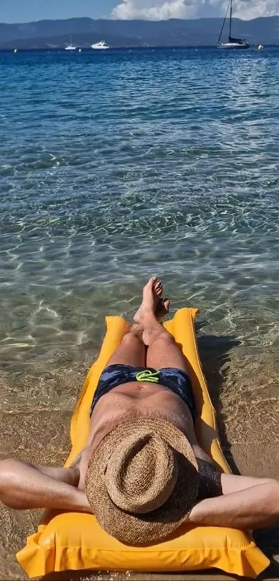 Man relaxing on a float at a serene beach.