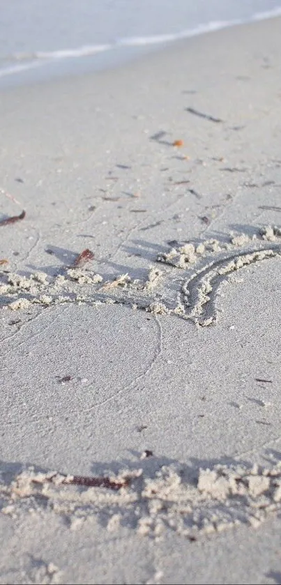 Sand art on a tranquil beach shore.