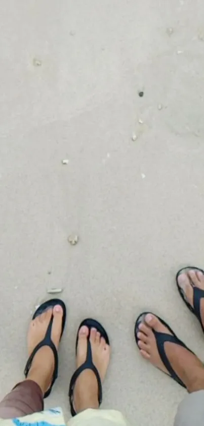 Feet wearing flip-flops on sandy beach, evoking tranquility and adventure.