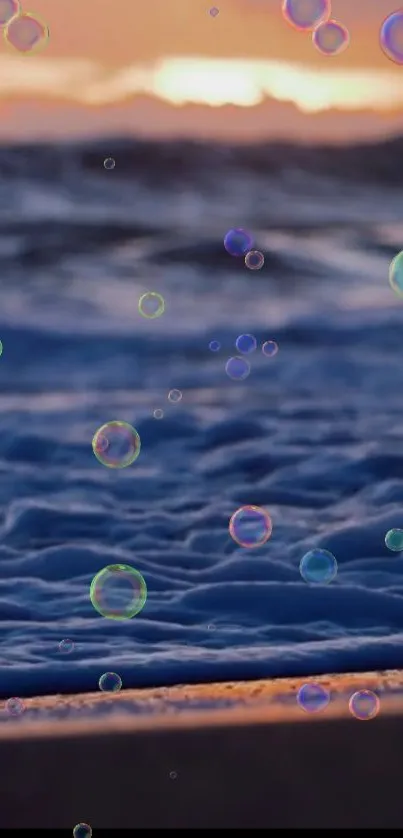 Beach sunset with colorful bubbles over gentle ocean waves.