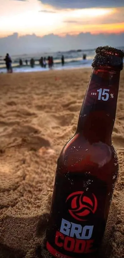 Sunset beach wallpaper with a drink bottle in the sand.