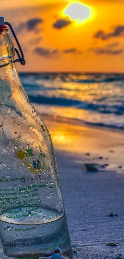 Glass bottle on beach during sunset with golden ocean waves.