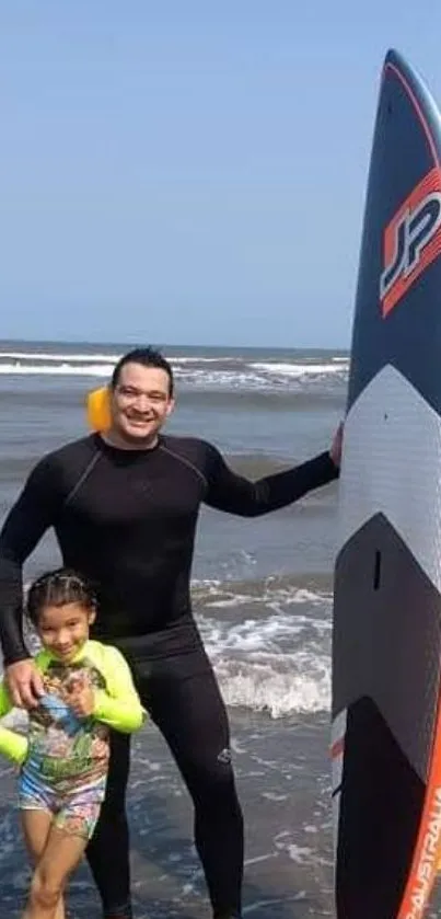 Surfer and child on beach with surfboard in hand.