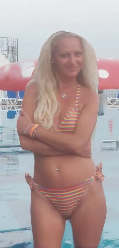 Woman in a colorful bikini by the poolside, exuding summer vibes.