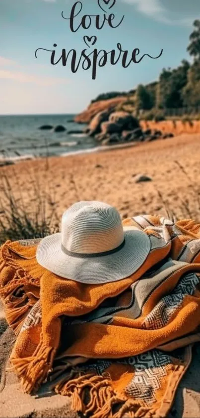 Tranquil beach scene with hat and inspiring text.