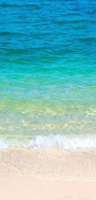 Beach waves and blue sea mobile wallpaper with sandy shore.