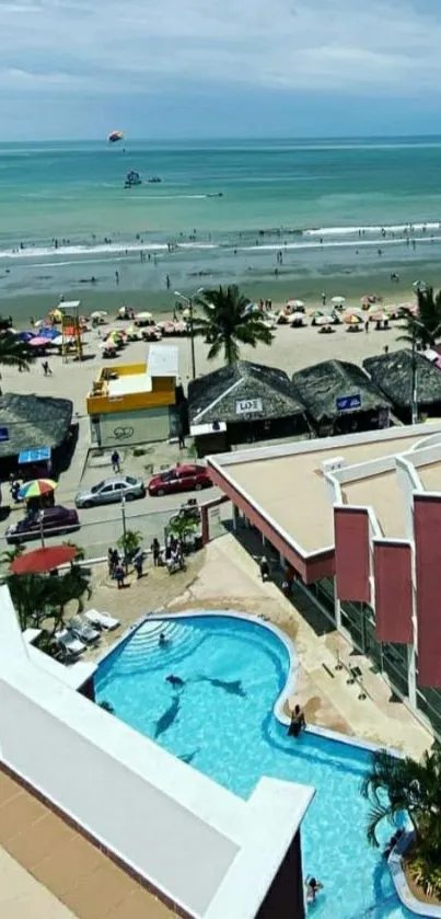 Aerial view of a beachside resort with pool and ocean.