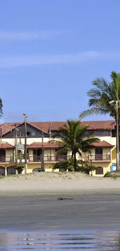 Beachfront villas with palm trees and blue sky.