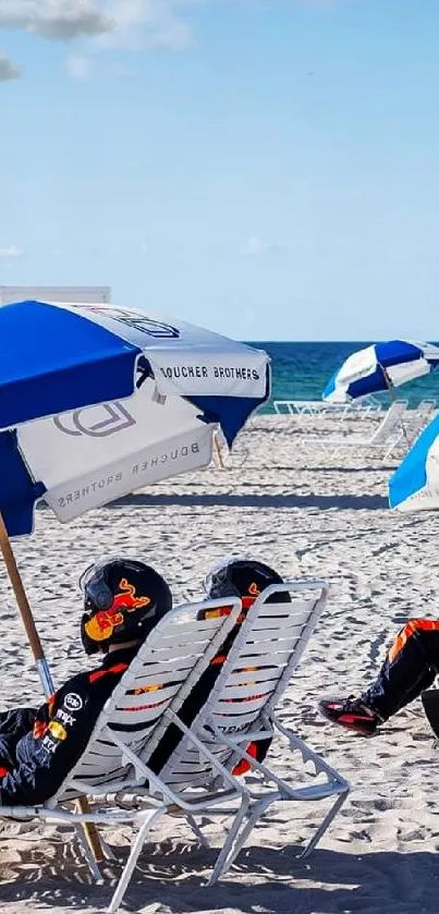 Vibrant beach scene with blue umbrellas and sandy beach chairs.