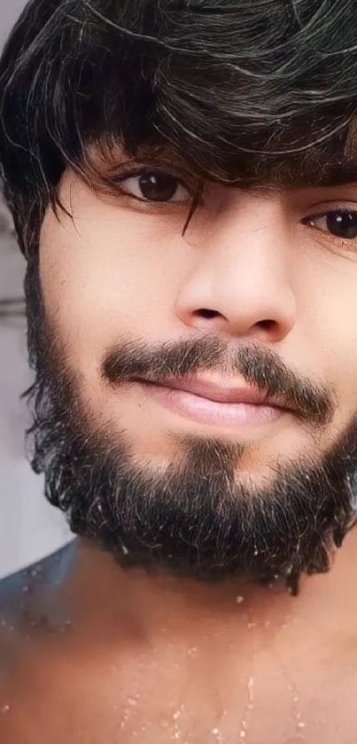 Close-up portrait of a bearded man smiling
