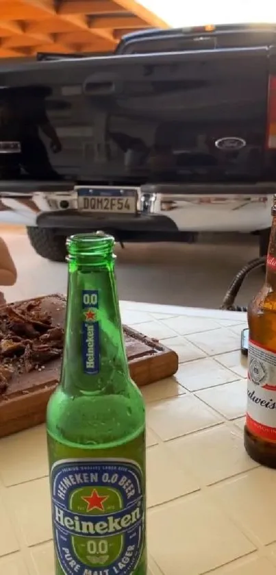 Beer bottles with a truck backdrop on a sunny day.