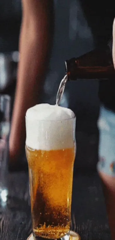 Amber beer poured into a glass with foam top.