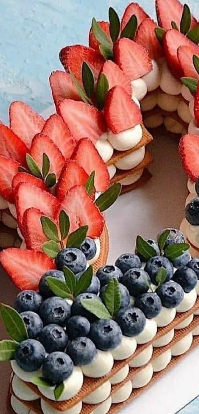 Berry cake with strawberries and blueberries on a blue background.