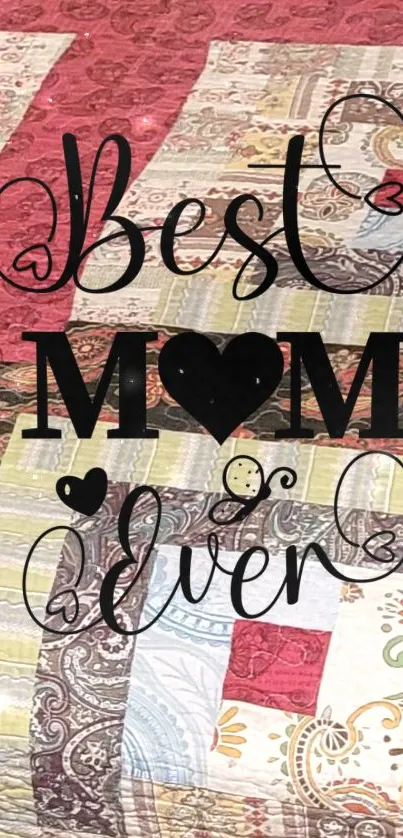 Quilt-inspired wallpaper with 'Best Mom Ever' text in decorative fonts.