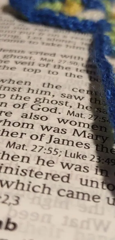 Bible page with crochet bookmark close-up.