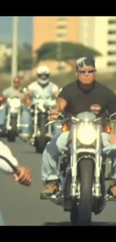 Biker group riding on open road.