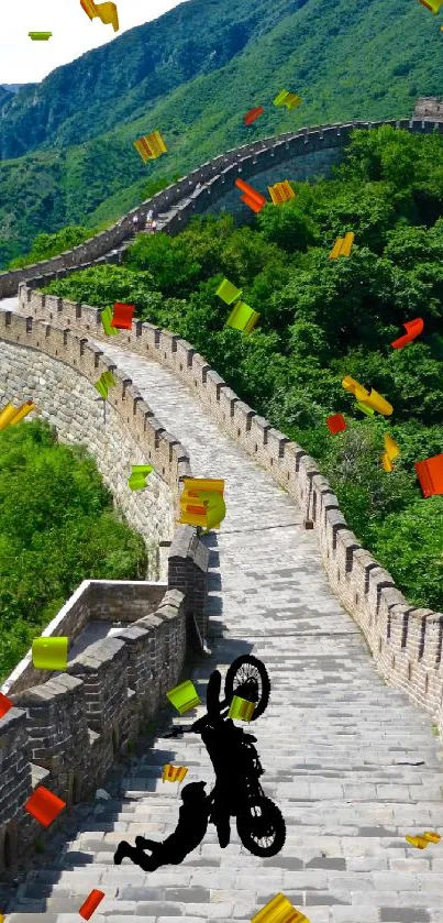 Biker performing a stunt on the Great Wall under clear sky.