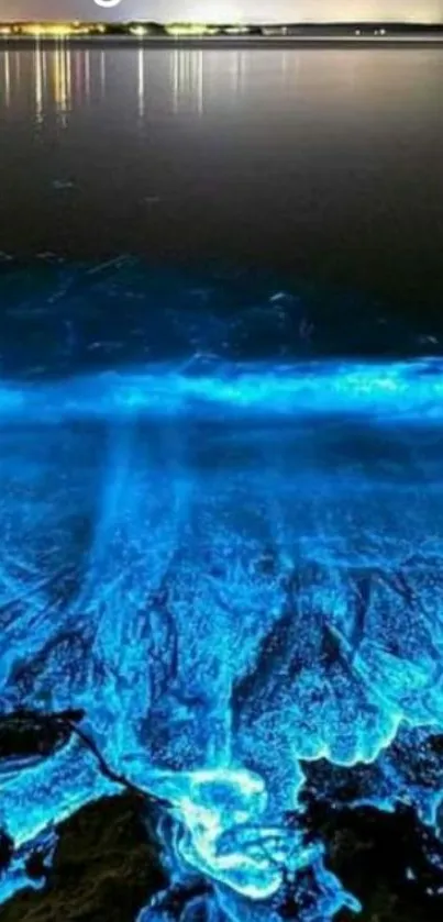 Magical bioluminescent ocean wallpaper glowing at night.