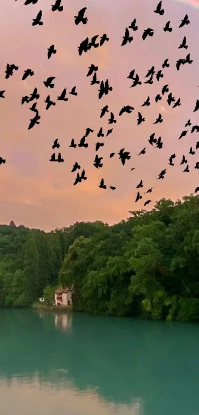 Silhouetted birds flying over a serene lake with lush green trees and a pastel sky.