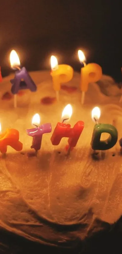 Birthday cake with colorful candles lit up in the dark atmosphere.