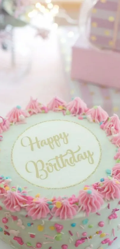 Festive pink birthday cake with sprinkles.