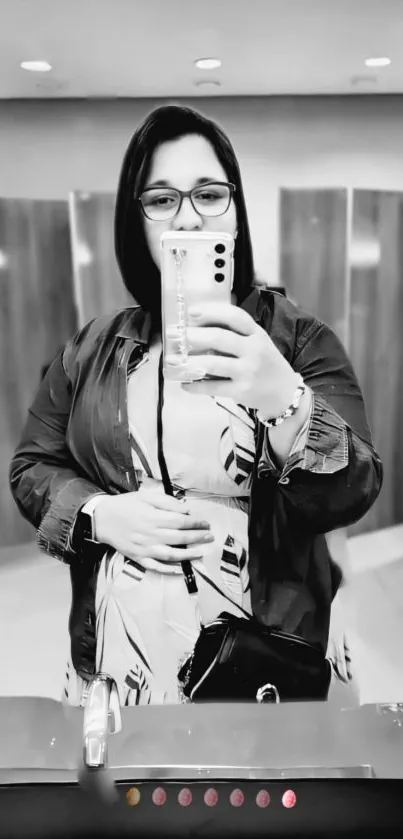 Monochrome mirror selfie with stylish outfit.