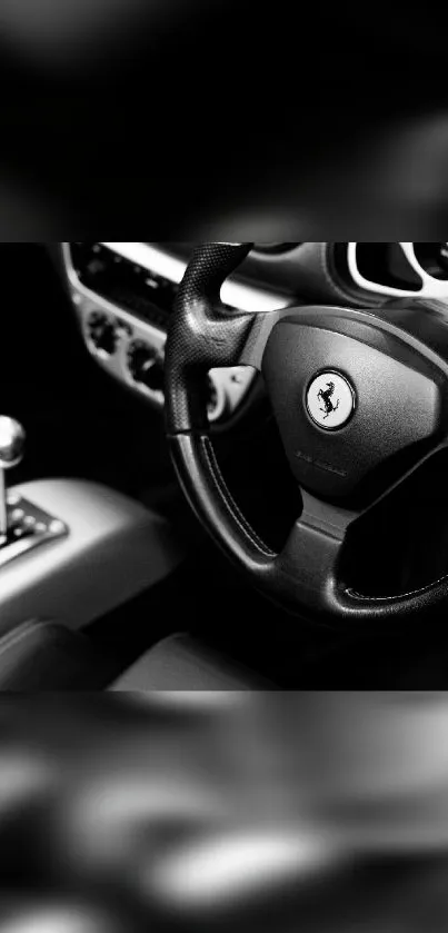 Black and white car interior with steering wheel and gear shift.