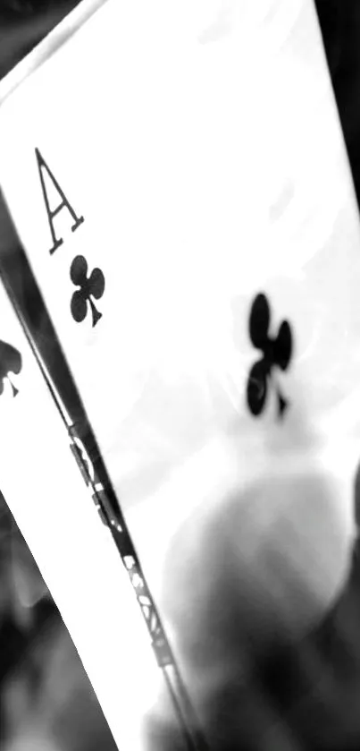 Black and white playing cards in elegant design for mobile wallpaper.