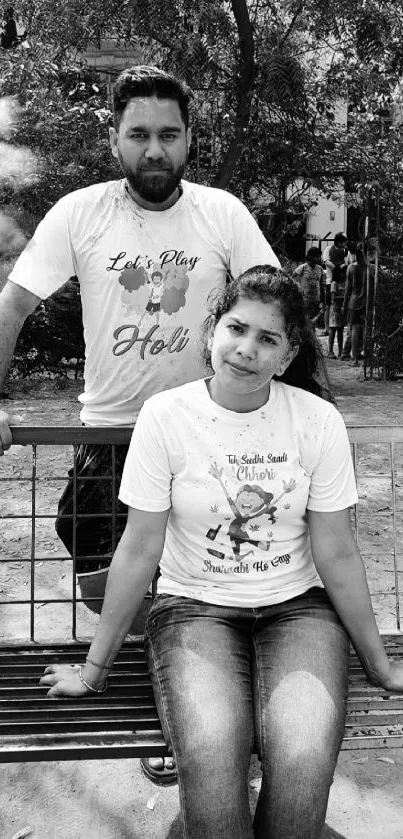 Black and white portrait of two people outdoors.