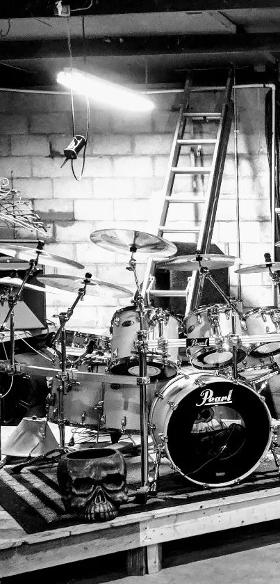 Black and white wallpaper of a music room with drums and guitar.