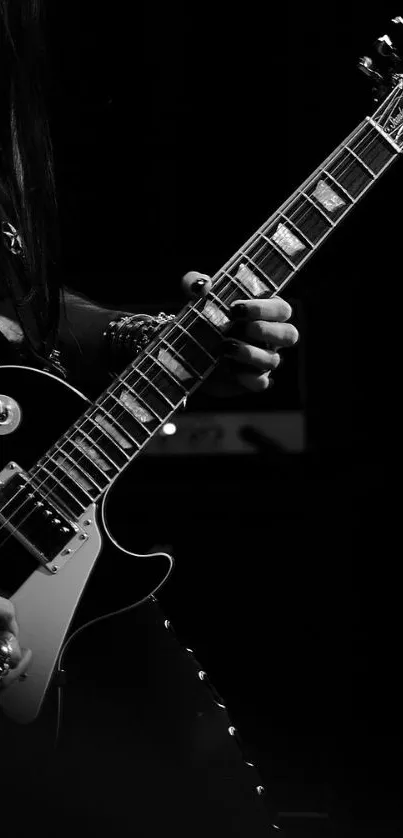 Black and white guitar close-up played passionately.