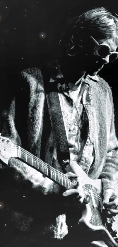 Black and white image of a guitarist playing passionately.