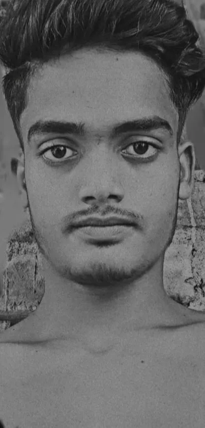 Black and white portrait of a person with a neutral expression.