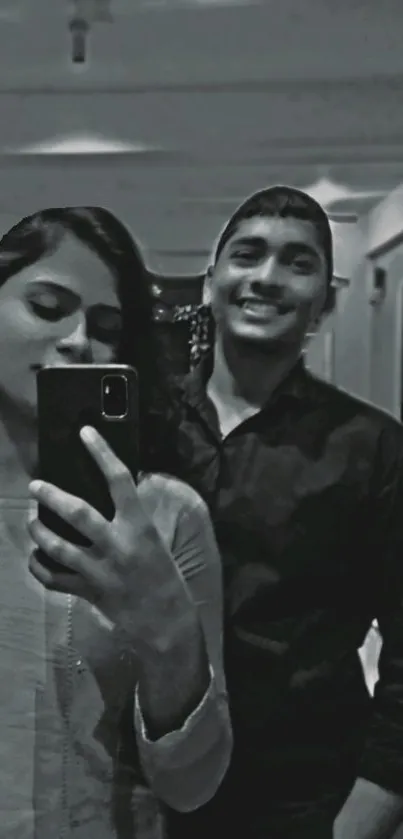 Black and white selfie of two people as mobile wallpaper.