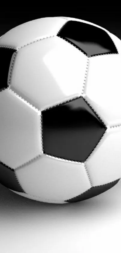 Black and white soccer ball on a sleek background.